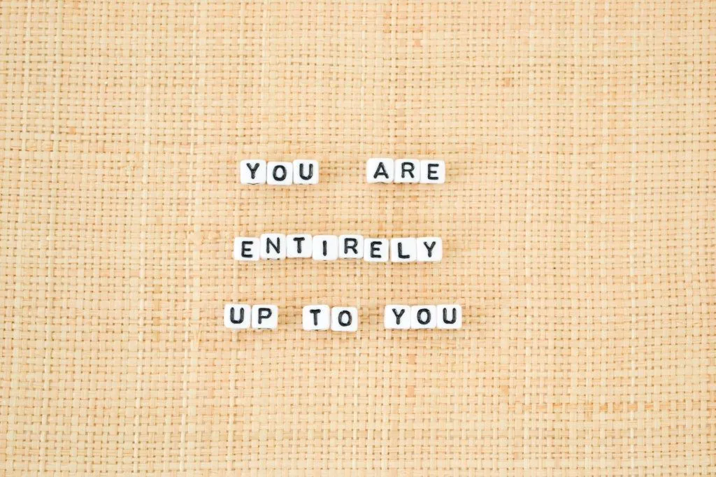Letter tiles reading “You are entirely up to you”