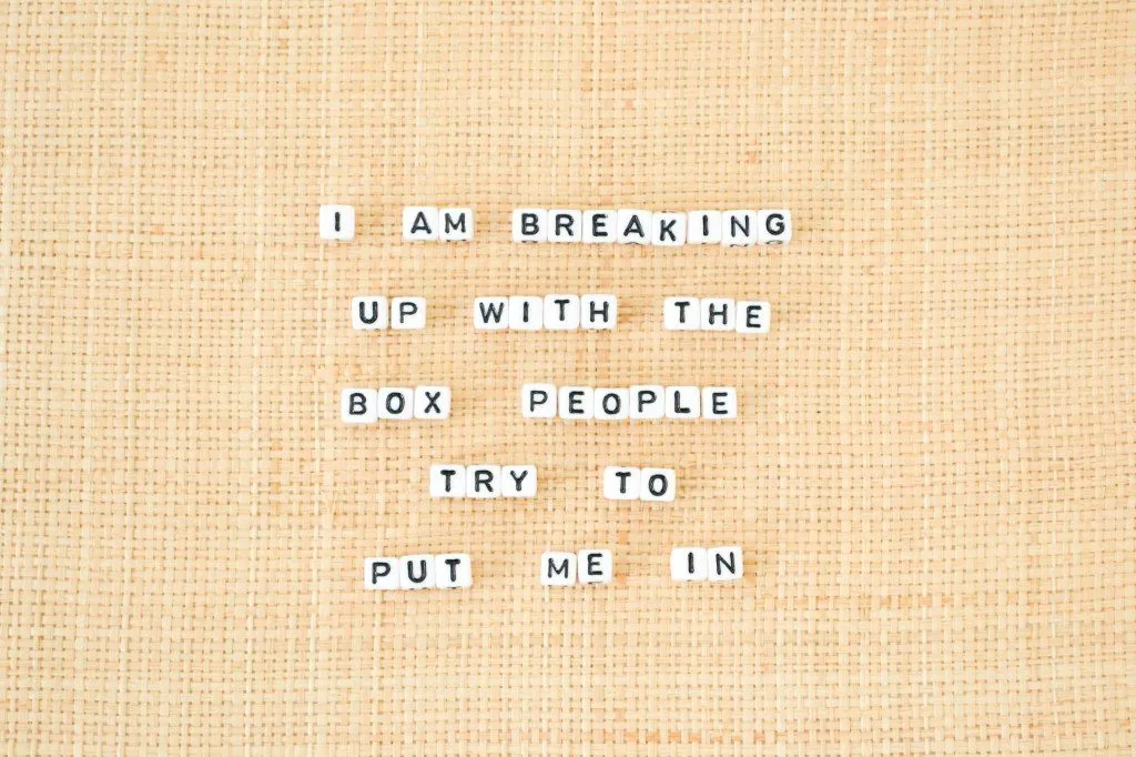 Letter tiles reading “I am breaking up with the box people try to put me in”